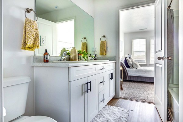 Expansive kitchen with stainless steel appliances at Jules on 3rd Apartments