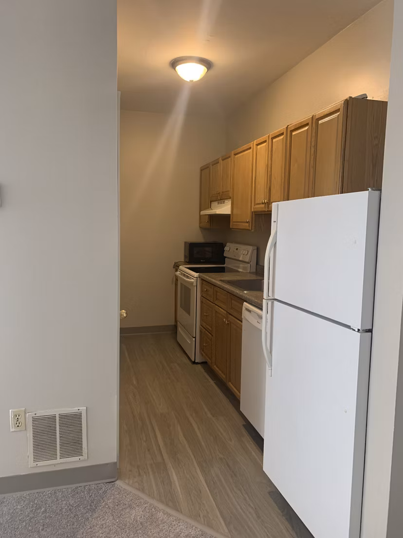 Modern kitchen with sleek countertops and stainless steel appliances in Colton Apartments, Greystar luxury apartments