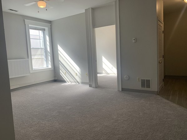 Spacious living room with contemporary decor at Colton Apartments