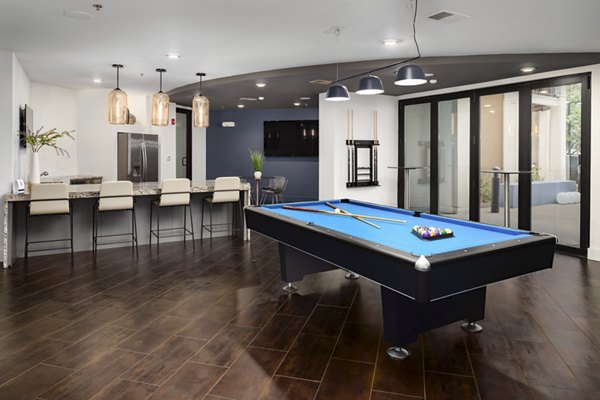 Clubhouse featuring modern design and cozy seating at Tapestry at Brentwood Town Center Apartments