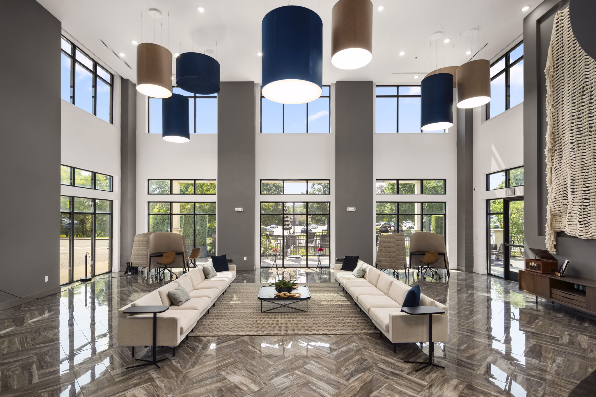 Clubhouse featuring modern design and cozy seating at Tapestry at Brentwood Town Center Apartments
