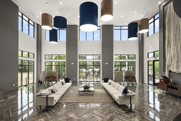 Clubhouse featuring modern design and cozy seating at Tapestry at Brentwood Town Center Apartments