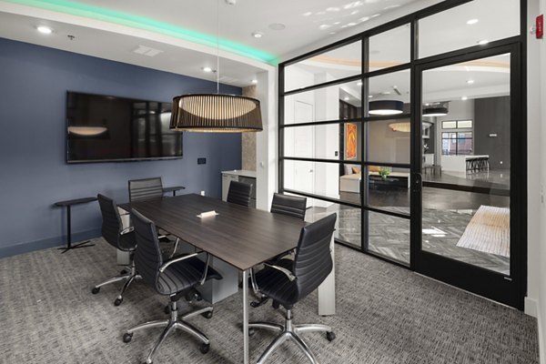 Clubhouse featuring modern seating and entertainment options at Tapestry at Brentwood Town Center Apartments