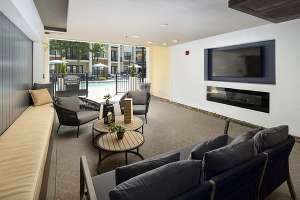 Clubhouse with modern design and seating in Tapestry at Brentwood Town Center Apartments