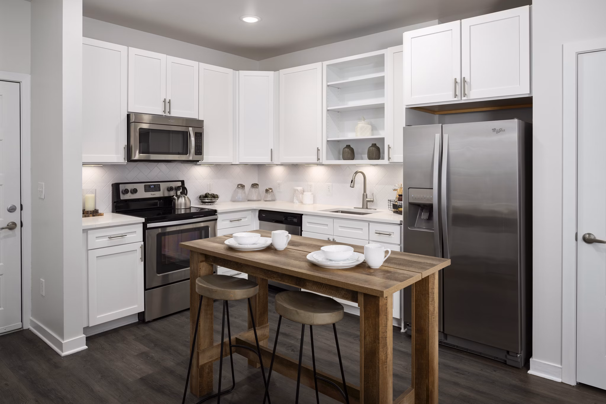 Modern kitchen with stainless steel appliances at Tapestry at Brentwood Town Center Apartments, ideal for luxury living