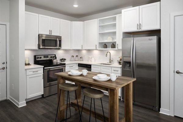 Modern kitchen with stainless steel appliances at Tapestry at Brentwood Town Center Apartments, ideal for luxury living