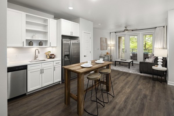 Modern kitchen with stainless steel appliances at Tapestry at Brentwood Town Center Apartments