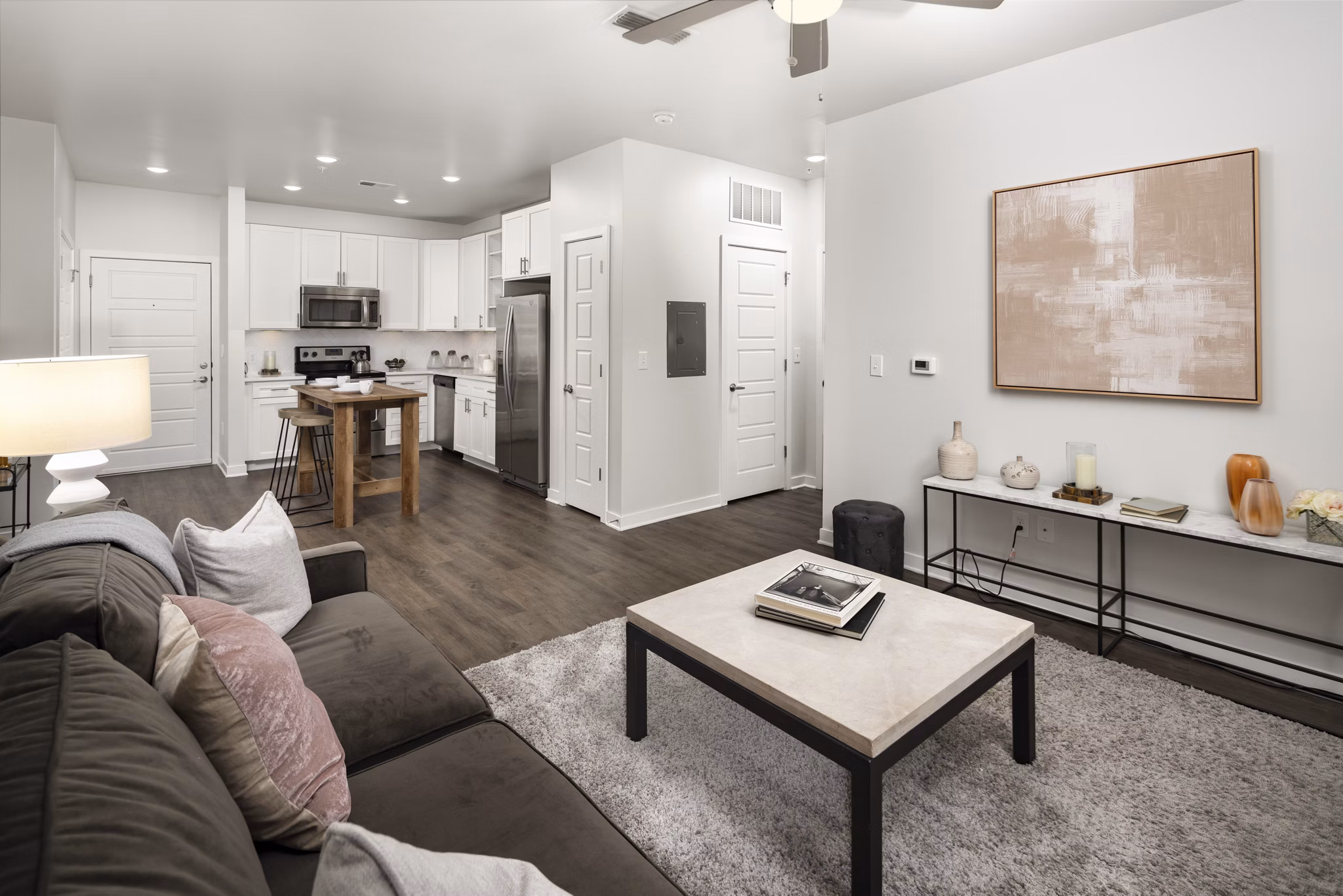 Spacious living room with modern decor in Tapestry at Brentwood Town Center Apartments