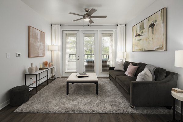 Modern living room with sleek furniture at Tapestry at Brentwood Town Center Apartments