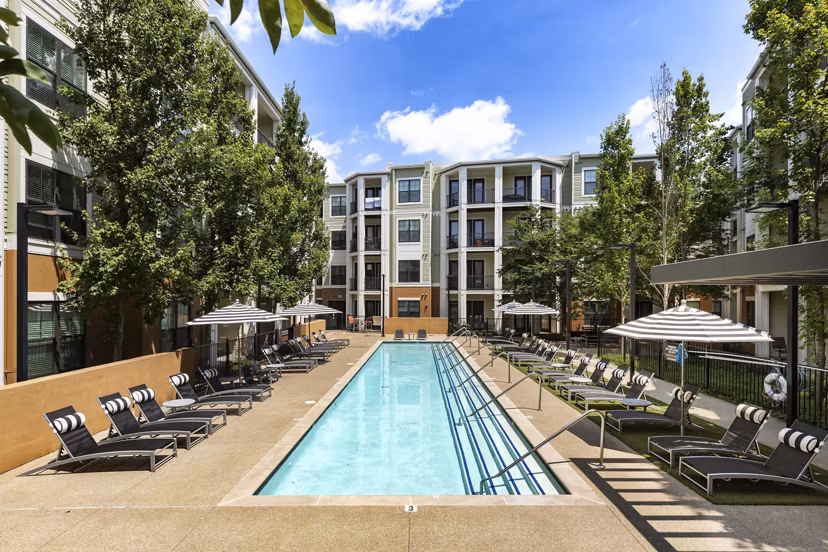 Relaxing outdoor pool area at Tapestry at Brentwood Town Center Apartments