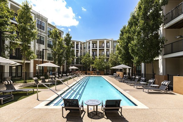 Relaxing outdoor pool area at Tapestry at Brentwood Town Center Apartments