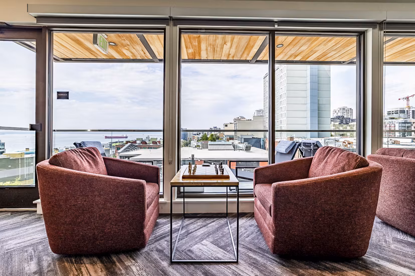 Clubhouse lobby with modern furnishings at Elara at the Market Apartments