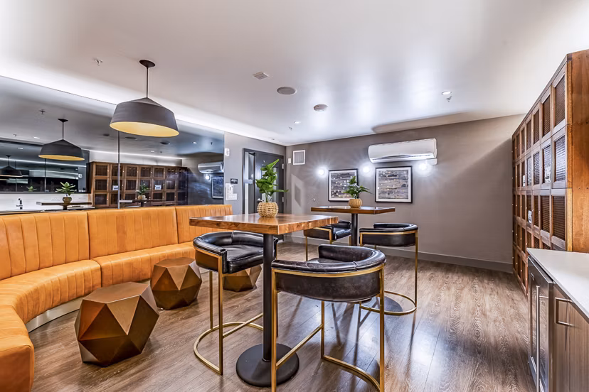 Elegant clubhouse with modern decor at Elara at the Market Apartments, perfect for social gatherings and relaxation
