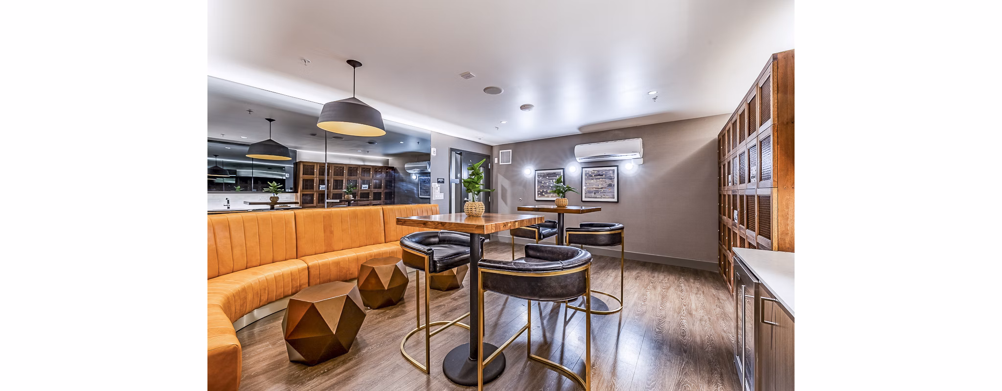 Elegant clubhouse with modern decor at Elara at the Market Apartments, perfect for social gatherings and relaxation