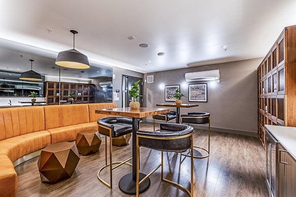 Elegant clubhouse with modern decor at Elara at the Market Apartments, perfect for social gatherings and relaxation