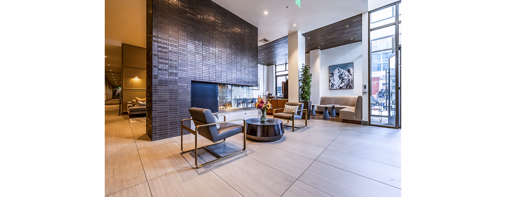 Clubhouse lobby featuring modern furnishings and cozy seating at Elara at the Market Apartments