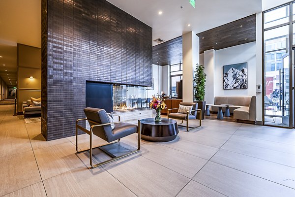 Clubhouse lobby featuring modern furnishings and cozy seating at Elara at the Market Apartments