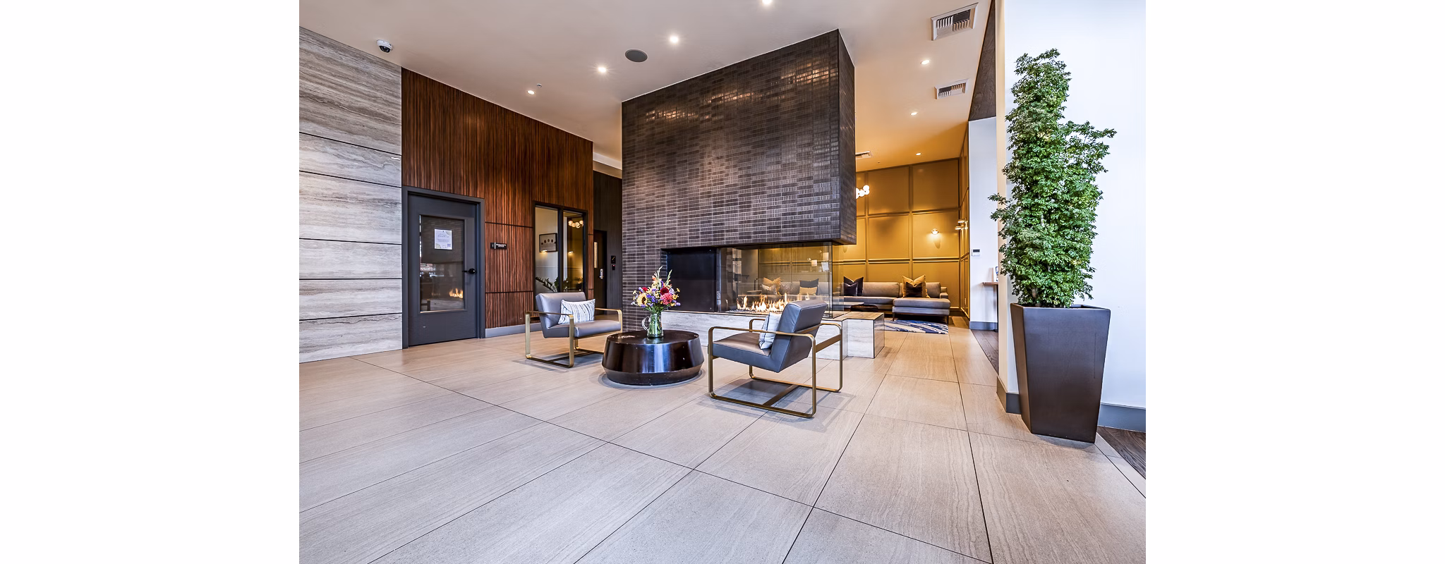 Modern clubhouse/lobby with elegant decor at Elara at the Market Apartments