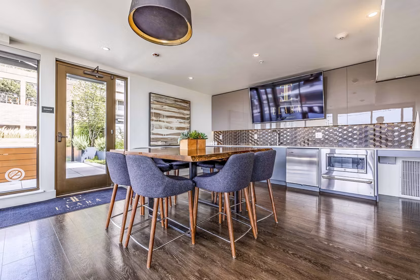Chic clubhouse featuring plush seating and modern decor at Elara at the Market Apartments
