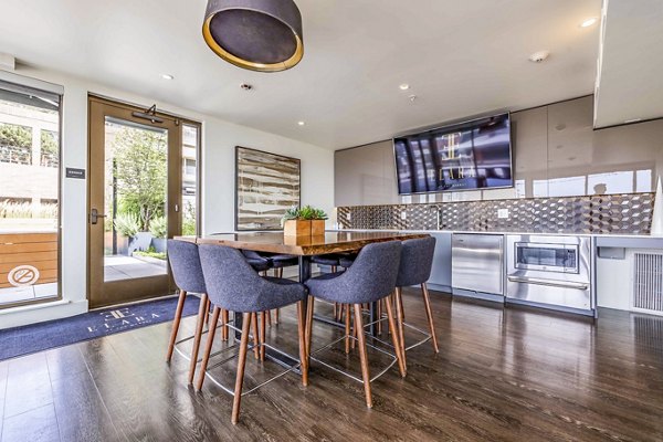 Chic clubhouse featuring plush seating and modern decor at Elara at the Market Apartments