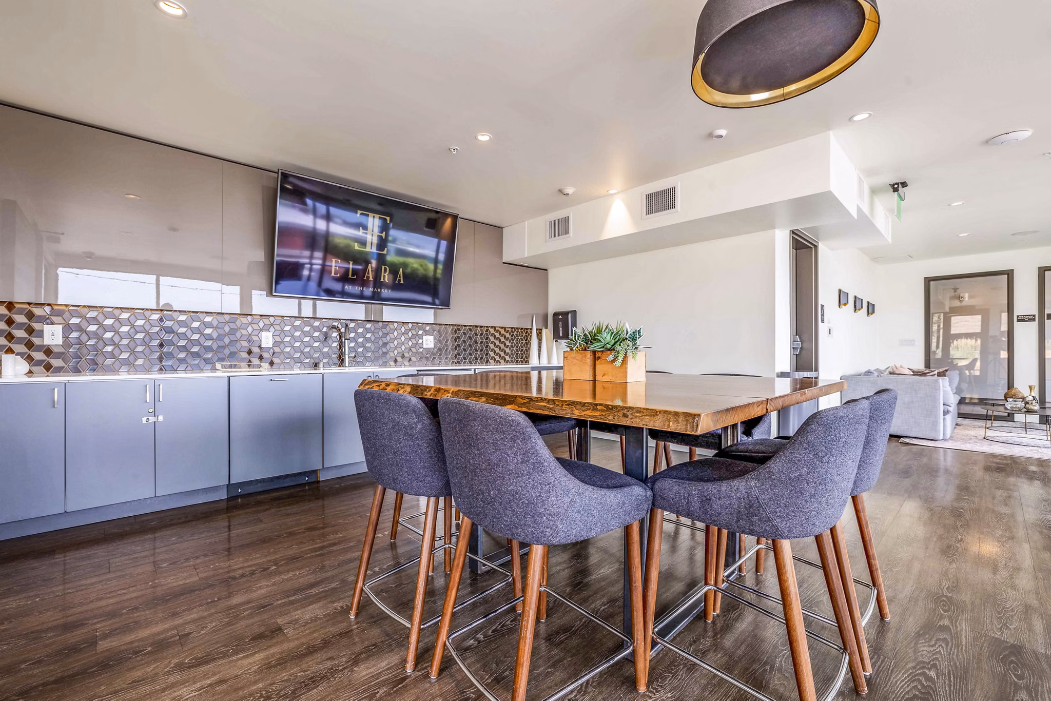 Clubhouse with modern decor and cozy seating at Elara at the Market Apartments