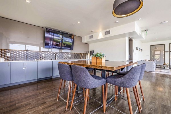 Clubhouse with modern decor and cozy seating at Elara at the Market Apartments