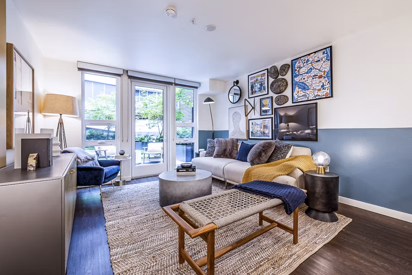 Living room featuring contemporary design and stylish furnishings at Elara at the Market Apartments