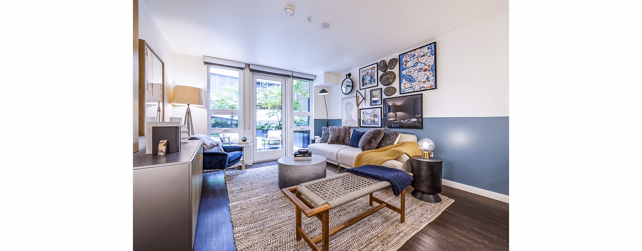 Living room featuring contemporary design and stylish furnishings at Elara at the Market Apartments