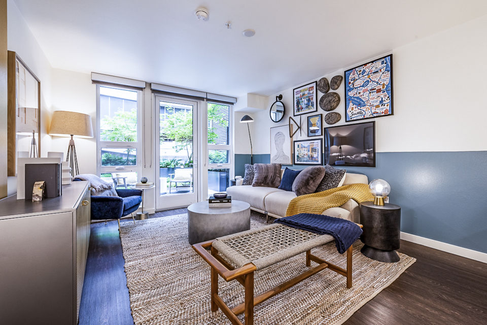 Living room featuring contemporary design and stylish furnishings at Elara at the Market Apartments