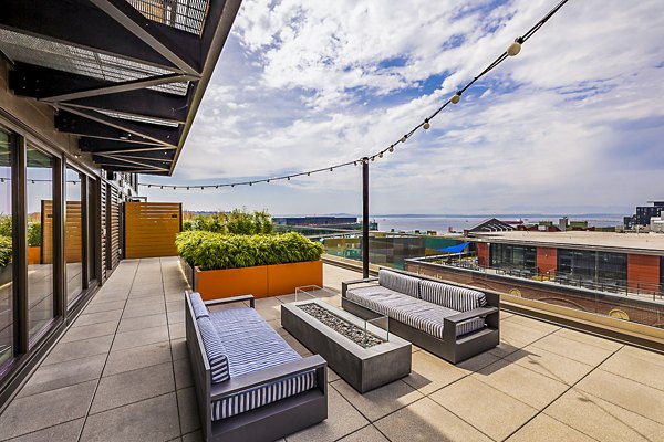 Patio with stylish seating at Elara at the Market Apartments, ideal for relaxation and entertainment, offering views of Market Street