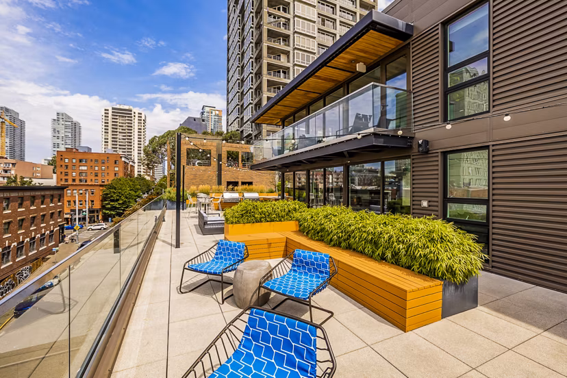 Private balcony with seating and lush views at Elara at the Market Apartments, Seattle's luxury housing option