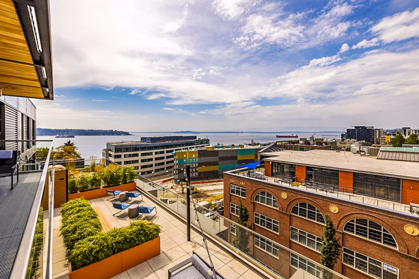 Private balcony with seating area at Elara at the Market Apartments offering city views