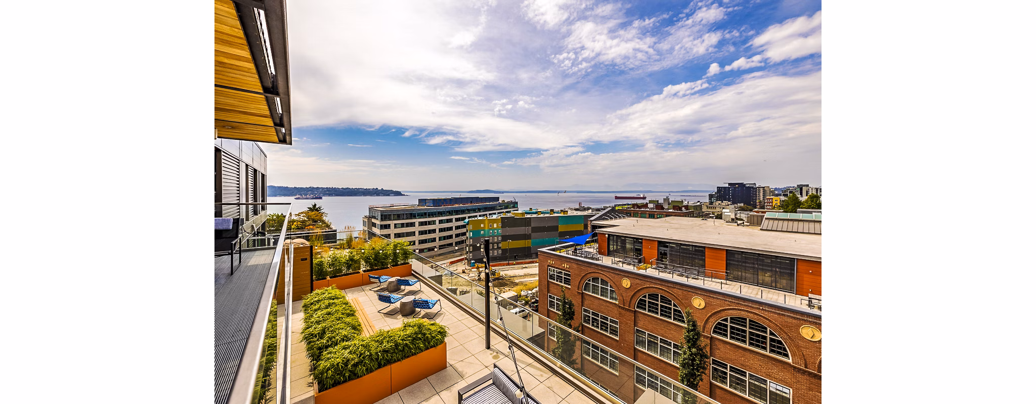 Private balcony with seating area at Elara at the Market Apartments offering city views