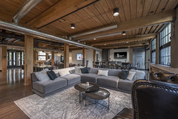 Modern community clubhouse with billiards and seating areas at Bancroft Lofts luxury apartments