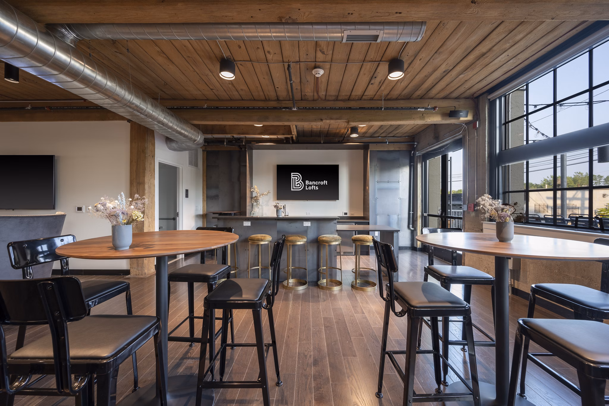 Clubhouse with modern design and comfortable seating at Bancroft Lofts luxury apartments