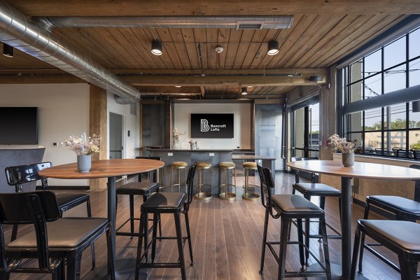 Clubhouse with modern design and comfortable seating at Bancroft Lofts luxury apartments