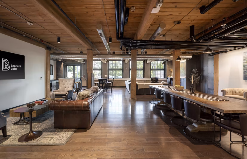 Clubhouse featuring modern design and cozy seating at Bancroft Lofts luxury apartments in Greystar's vibrant community