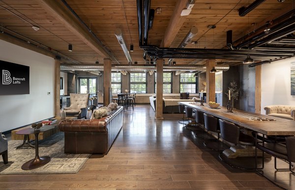 Clubhouse featuring modern design and cozy seating at Bancroft Lofts luxury apartments in Greystar's vibrant community