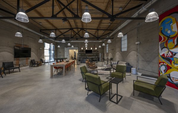 Clubhouse featuring modern decor and social lounge at Bancroft Lofts luxury apartments