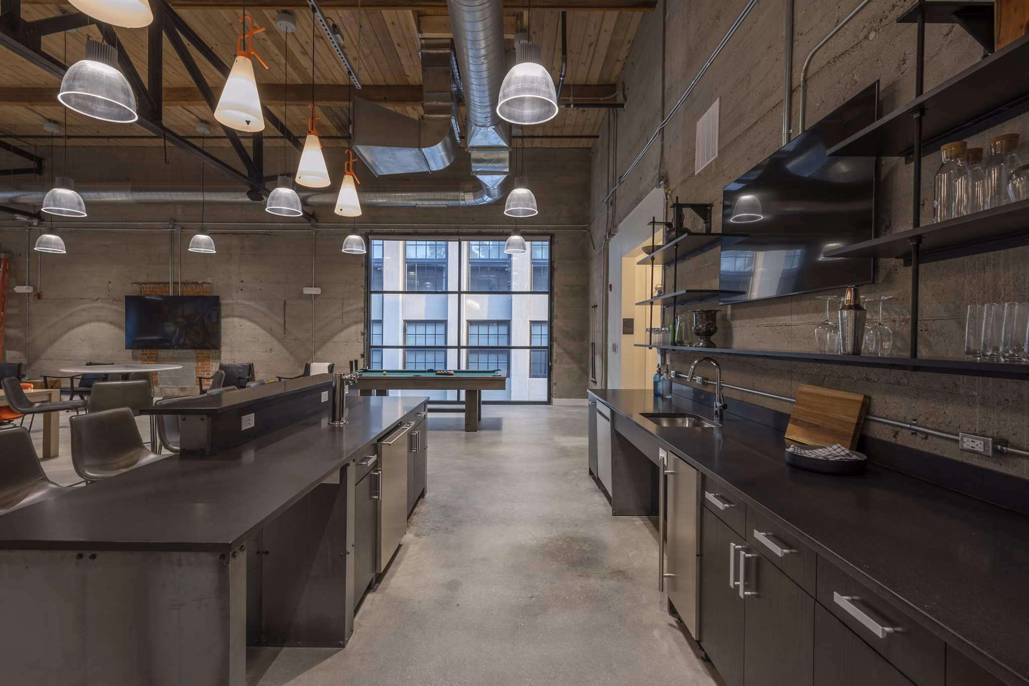 Clubhouse at Bancroft Lofts featuring modern design and comfortable seating areas in an upscale apartment complex