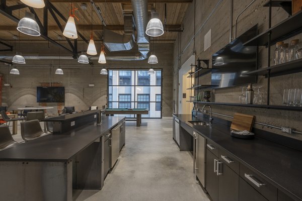 Clubhouse at Bancroft Lofts featuring modern design and comfortable seating areas in an upscale apartment complex