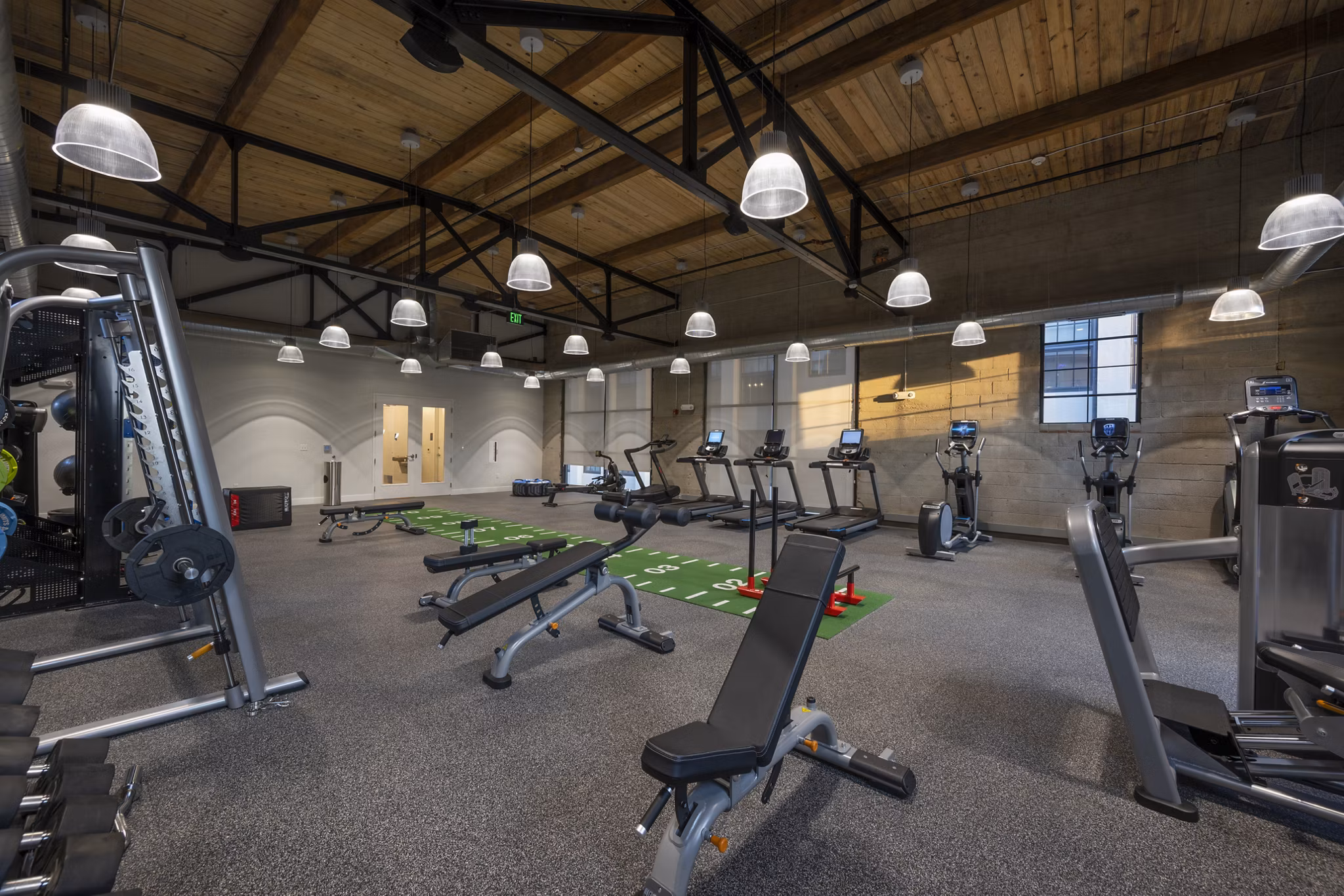 Spacious fitness center with top-notch equipment at Bancroft Lofts in luxury Greystar apartments