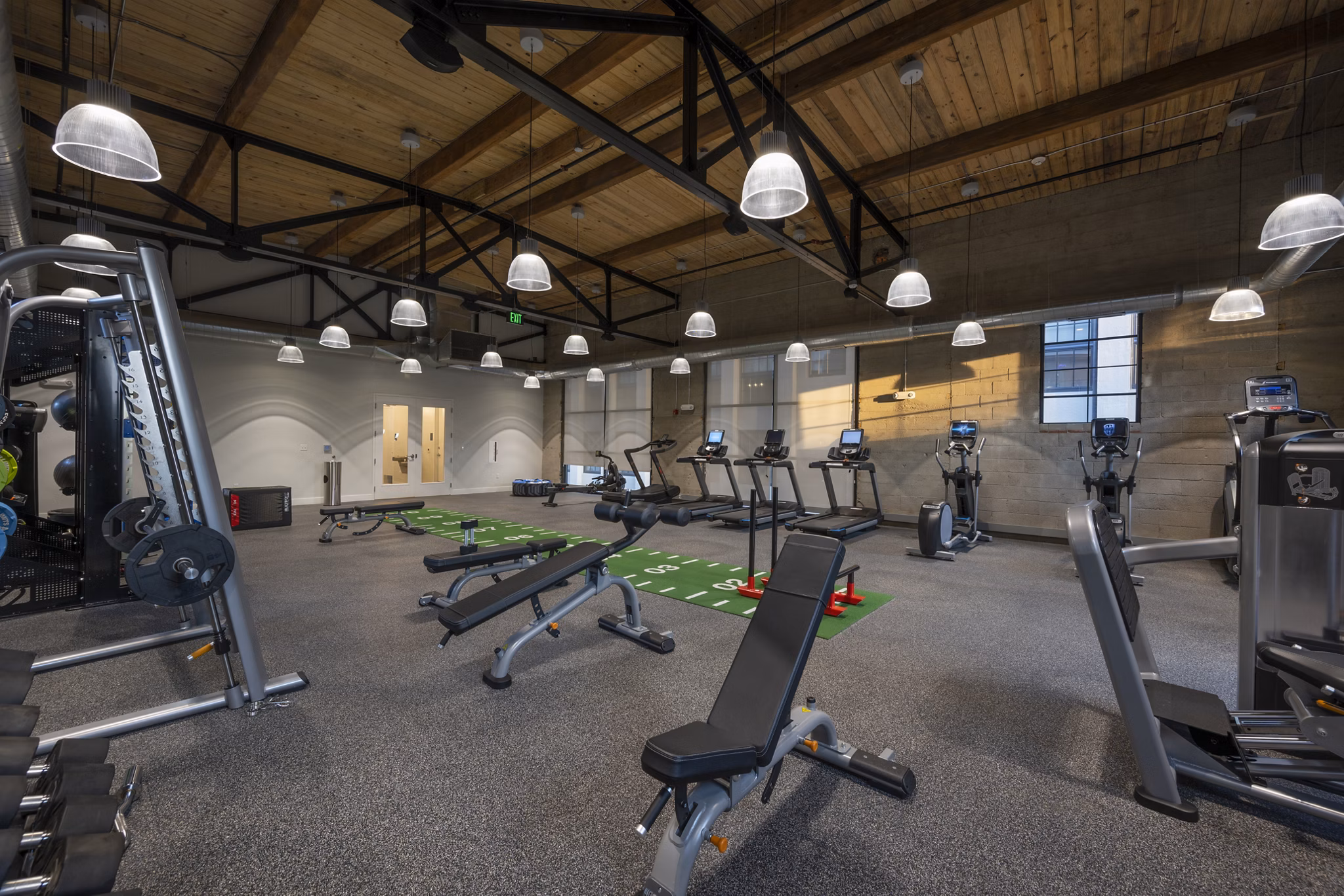 Spacious fitness center with top-notch equipment at Bancroft Lofts in luxury Greystar apartments