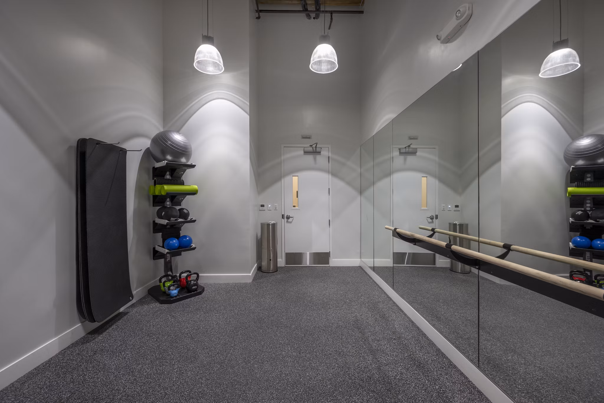 yoga/spin studio with mirrors and bikes at Bancroft Lofts luxury apartments in vibrant urban location