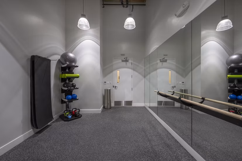 yoga/spin studio with mirrors and bikes at Bancroft Lofts luxury apartments in vibrant urban location