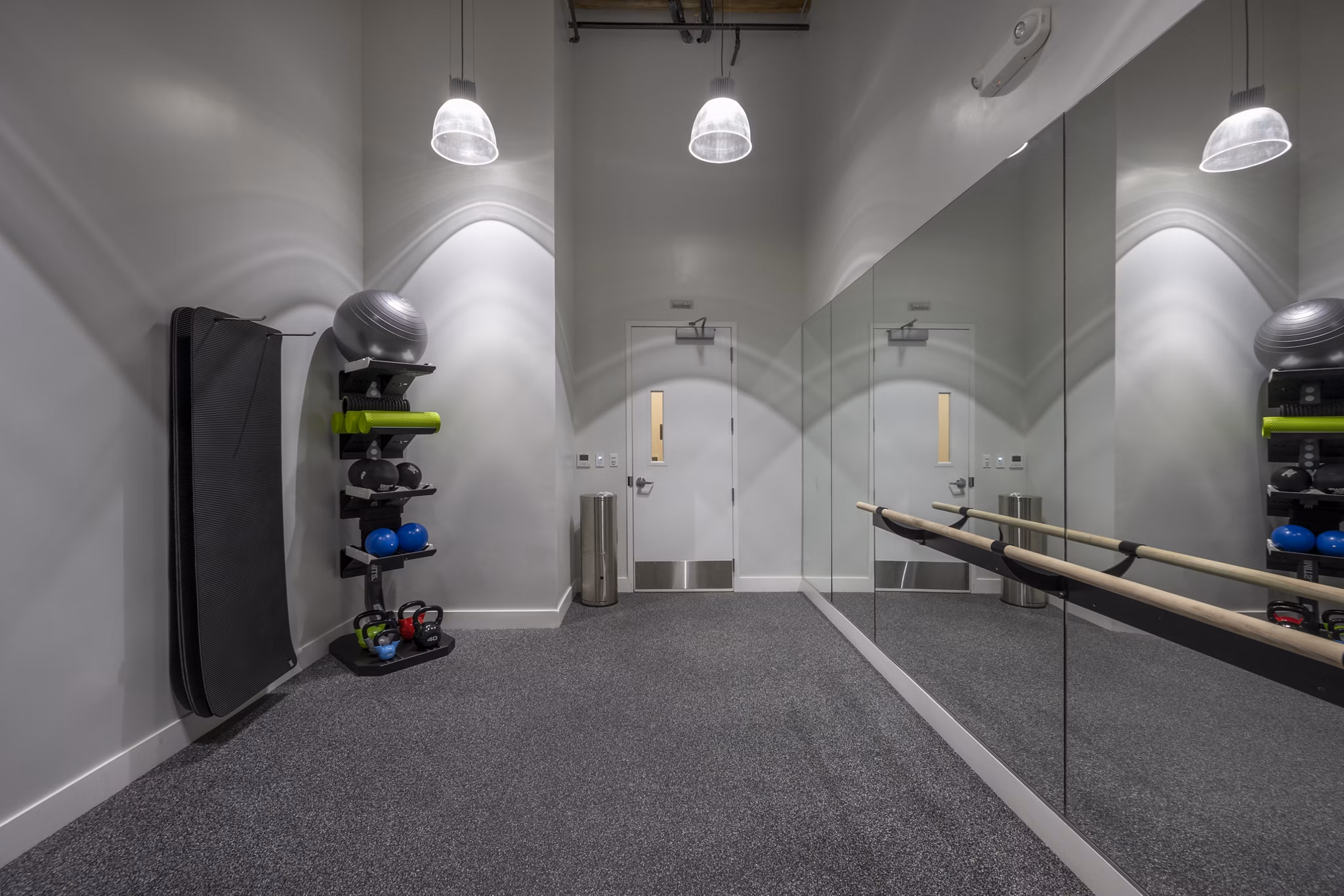 yoga/spin studio with mirrors and bikes at Bancroft Lofts luxury apartments in vibrant urban location