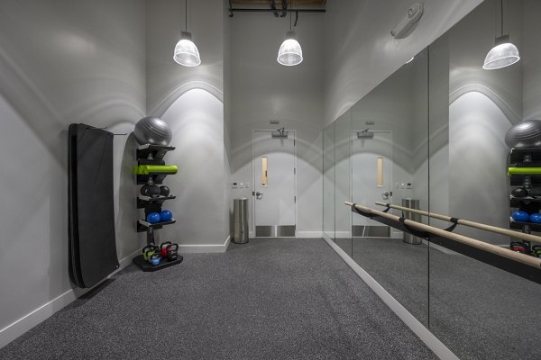 yoga/spin studio with mirrors and bikes at Bancroft Lofts luxury apartments in vibrant urban location