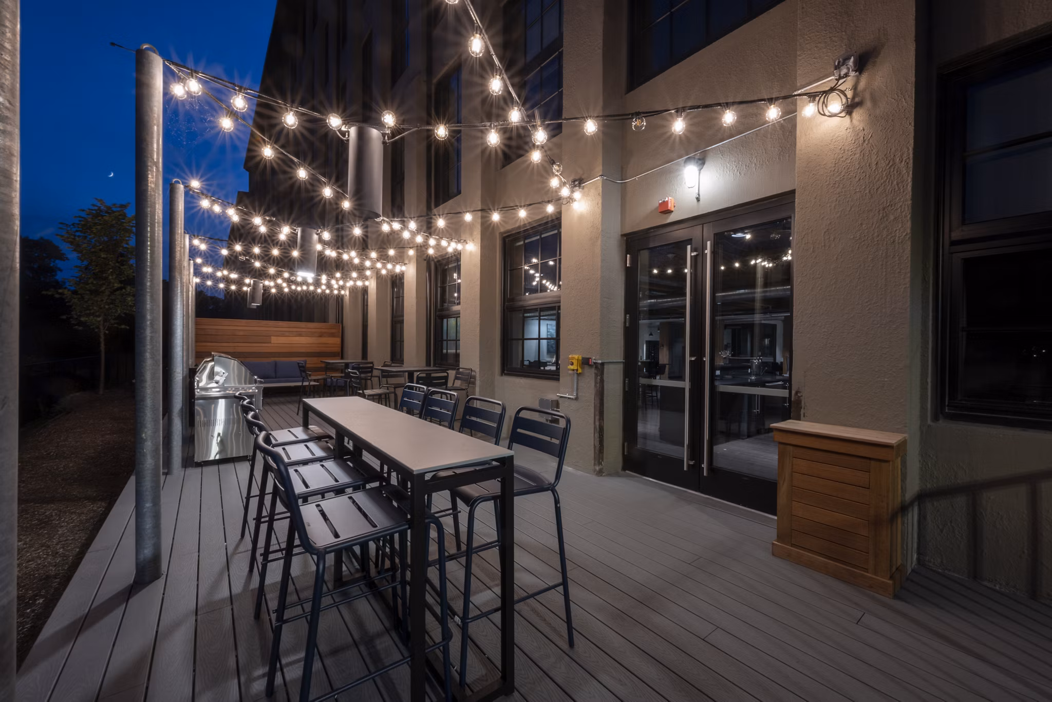Outdoor grill area with modern appliances at Bancroft Lofts luxury apartments