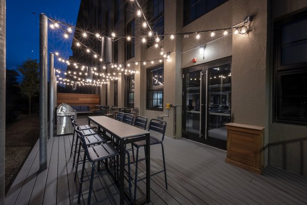 Outdoor grill area with modern appliances at Bancroft Lofts luxury apartments