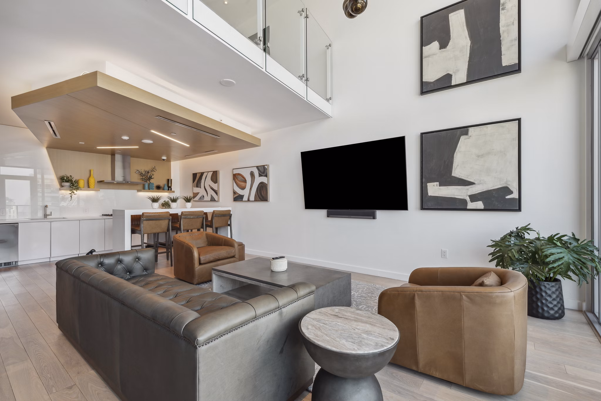 Modern clubhouse with lounge seating and community kitchen at K1 Apartments in the heart of San Diego